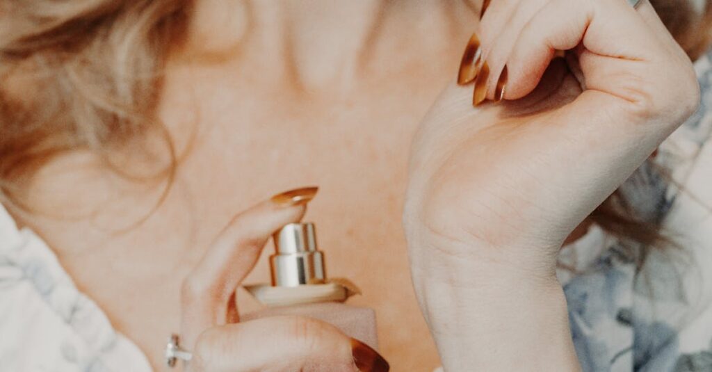 Close-up of a woman spraying perfume on her wrist, showcasing elegance and femininity.